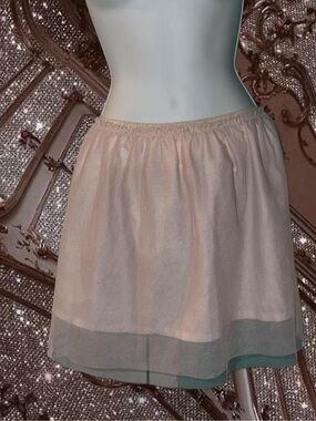 Soft Pink Mini Skirt with Sheer Overlay